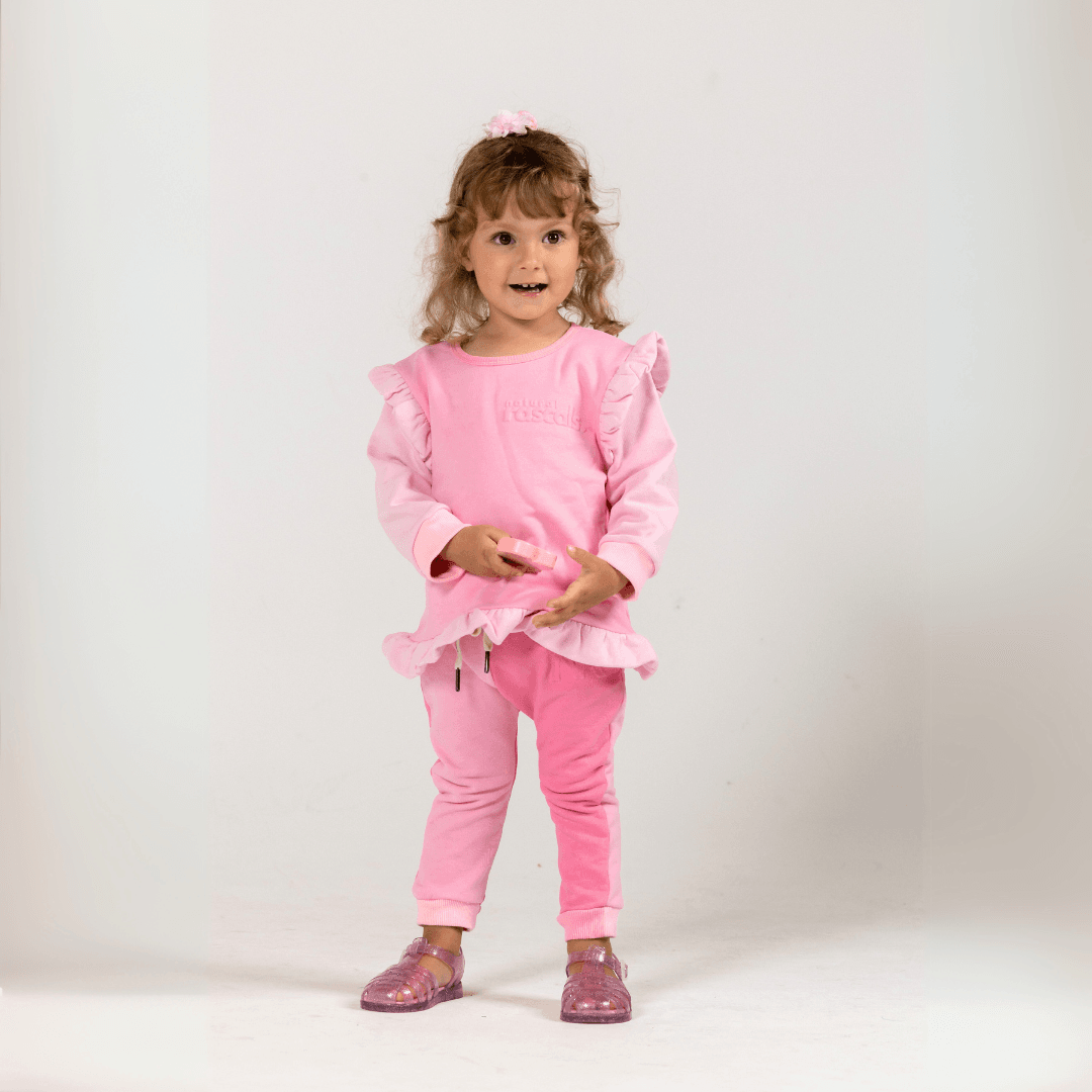 Child standing in premium Spill-Resistant Baby & Toddler Sweat Jogger two tone, Raspberry & Candy Pink Two-Tone by Natural Rascals