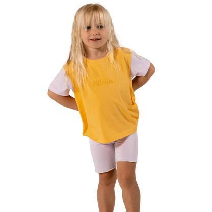 Child in soft lilac spill-resistant baby toddler bike shorts set by Natural Rascals on transparent background