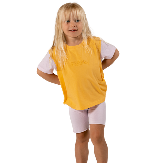 Child in soft lilac spill-resistant baby toddler bike shorts set by Natural Rascals on transparent background