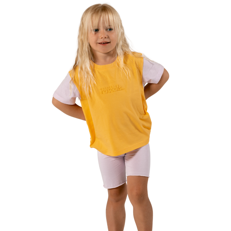 Child in soft lilac spill-resistant baby toddler bike shorts set by Natural Rascals on transparent background