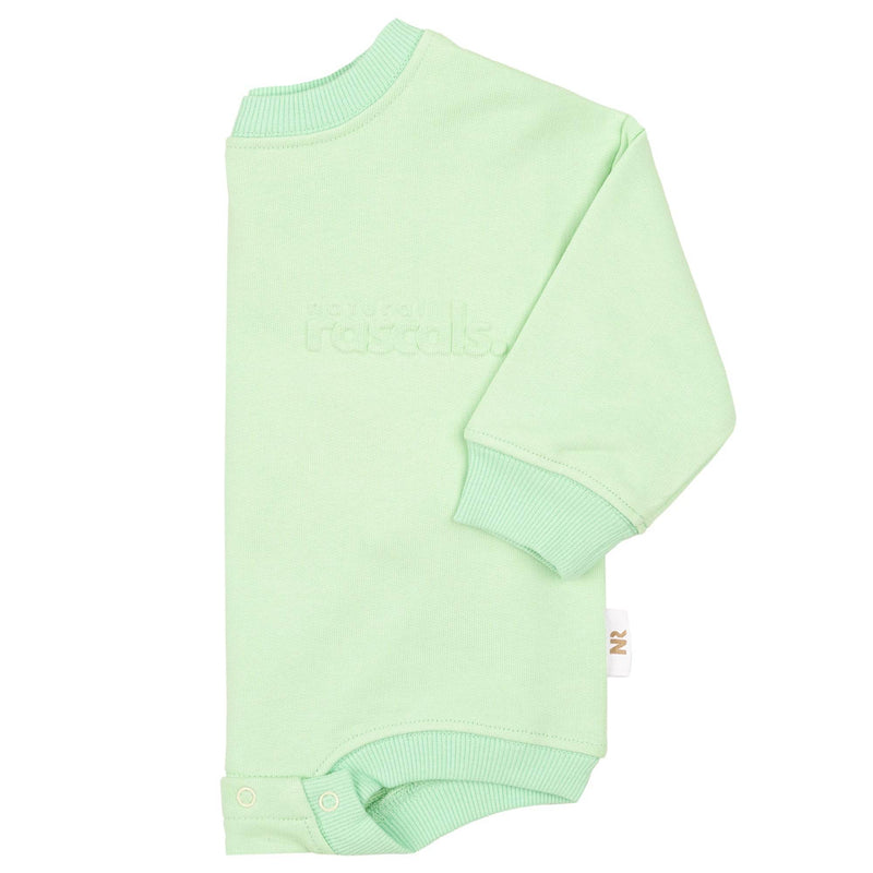 Side flat lay image of the mint green spill resistant romper by Natural Rascals