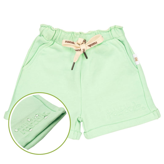 Baby wearing a lemonade yellow, oat and mint green Spill resistant shorts and sweat set by Natural Rascals on a transparent background