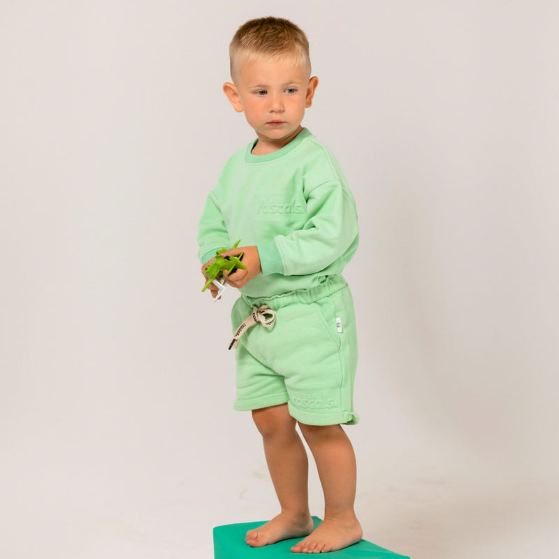 Child modeling Natural Rascals mint green summer shorts and mint green spill resistant romper