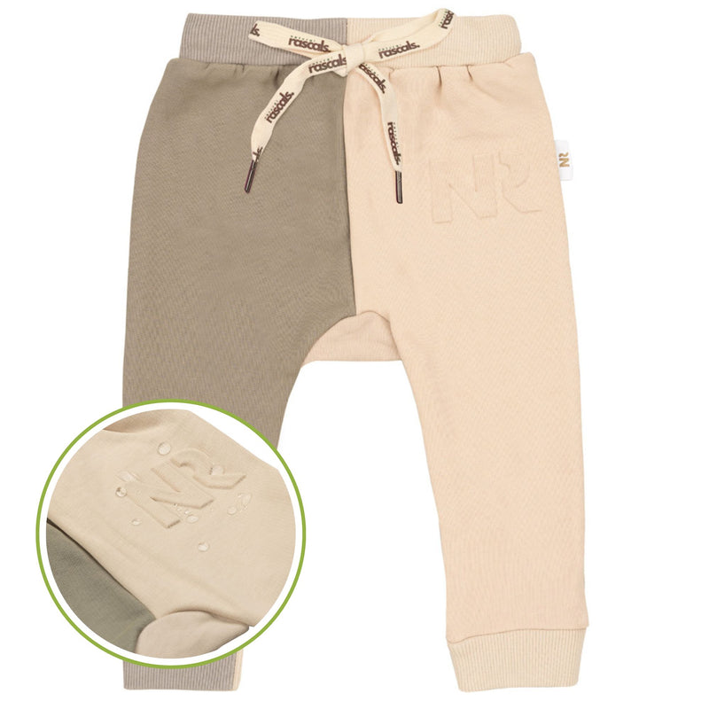 spill-resistant close-up of earthy and oat spill-resistant baby toddler sweat jogger jumper also showing the water beading by Natural Rascals.