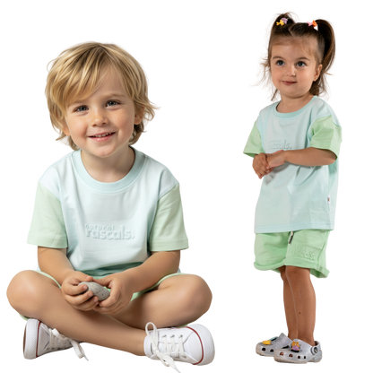 two children wearing matching clothes in airy blue and mint green spill-resistant baby toddler tee by Natural Rascals 