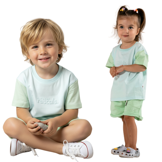 two children wearing matching clothes in airy blue and mint green spill-resistant baby toddler tee by Natural Rascals 